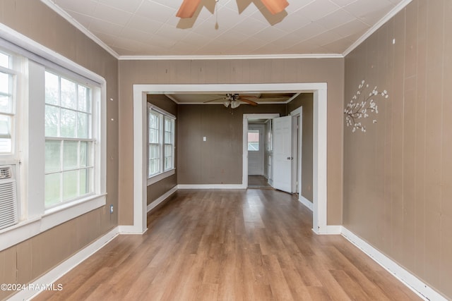 hall featuring crown molding and light hardwood / wood-style flooring