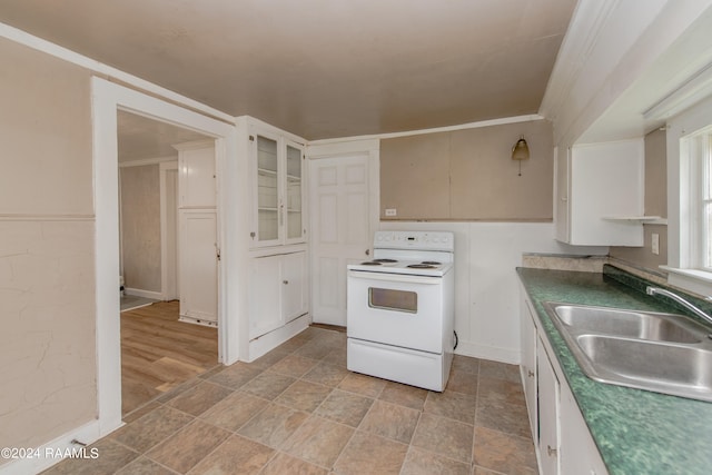 kitchen with white range with electric cooktop, ornamental molding, light tile floors, and sink