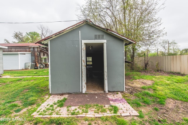 view of outdoor structure featuring a yard