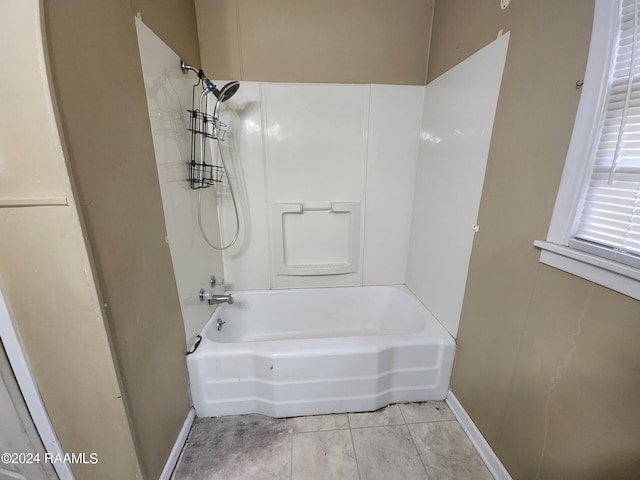 bathroom featuring shower / washtub combination and tile patterned flooring