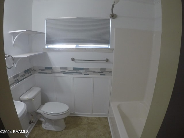 bathroom featuring toilet and tile patterned floors