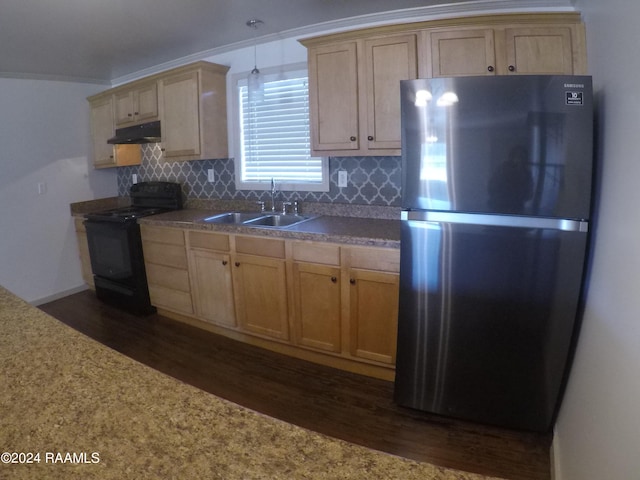 kitchen featuring black electric range oven, backsplash, sink, dark hardwood / wood-style floors, and stainless steel fridge