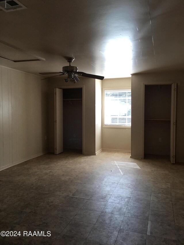 spare room with ceiling fan