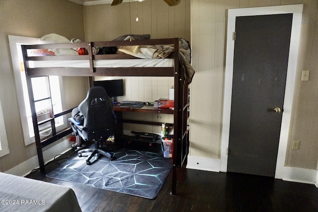 bedroom with dark wood-type flooring