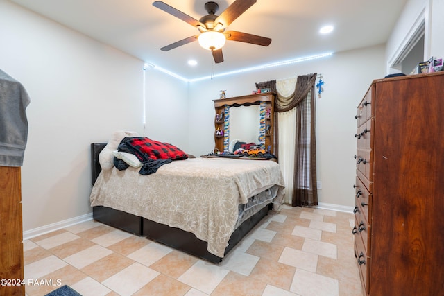 bedroom with ceiling fan and light tile floors