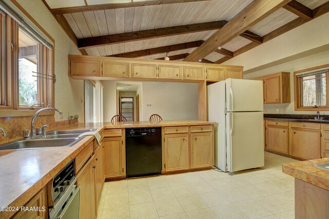 kitchen featuring white refrigerator, black dishwasher, vaulted ceiling with beams, light tile floors, and sink