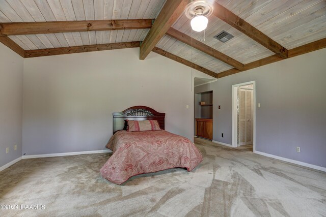 unfurnished bedroom with lofted ceiling with beams, wood ceiling, and light carpet