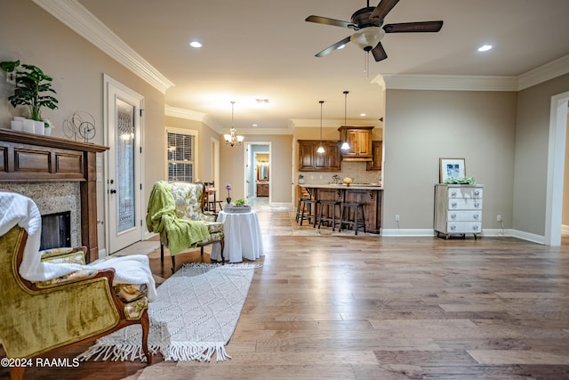 100 Giverny Pl, Lafayette, LA 70508 - living room featuring light wood finished floors, recessed lighting, a ceiling fan, a high end fireplace, and a chandelier