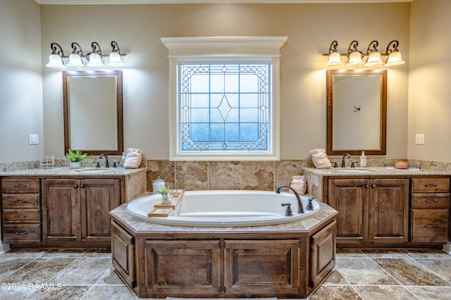 100 Giverny Pl, Lafayette, LA 70508 - bathroom with two vanities, a garden tub, and stone finish flooring
