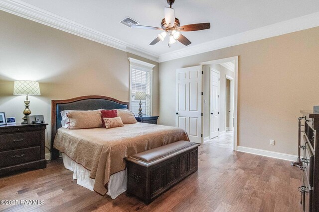 100 Giverny Pl, Lafayette, LA 70508 - bedroom with crown molding, wood finished floors, and a ceiling fan