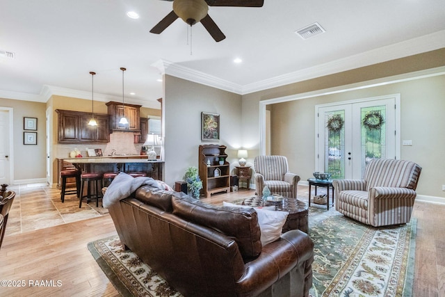 100 Giverny Pl, Lafayette, LA 70508 - living room featuring a ceiling fan, french doors, ornamental molding, and recessed lighting