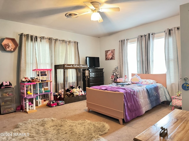 bedroom featuring ceiling fan and light colored carpet