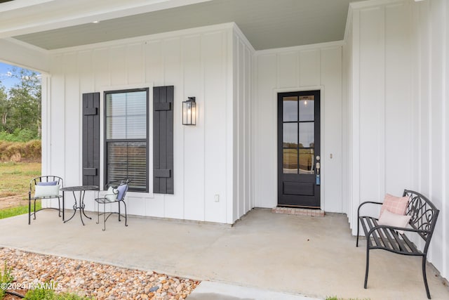 view of exterior entry featuring a porch