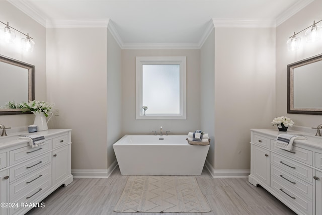 bathroom featuring vanity, wood-type flooring, a washtub, and ornamental molding