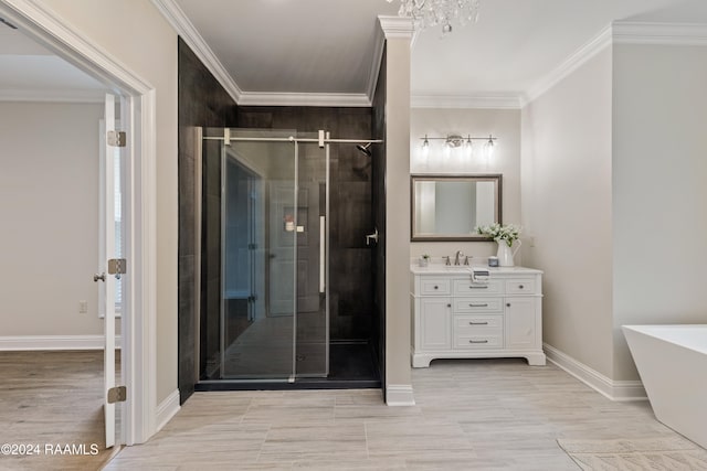 bathroom featuring plus walk in shower, ornamental molding, a chandelier, and vanity