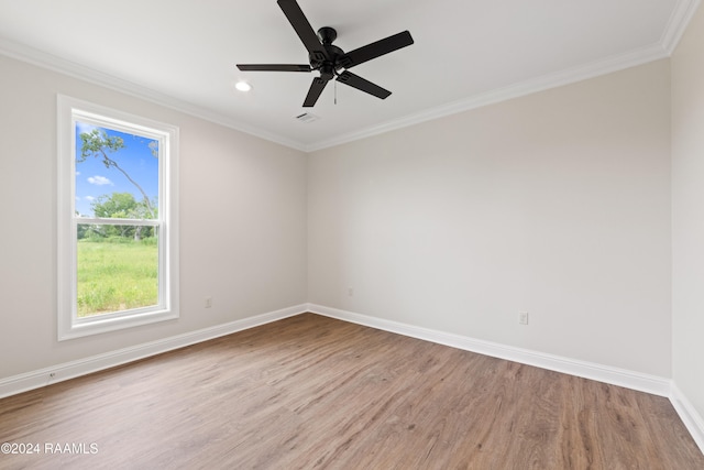 empty room featuring ceiling fan, crown molding, and light hardwood / wood-style flooring