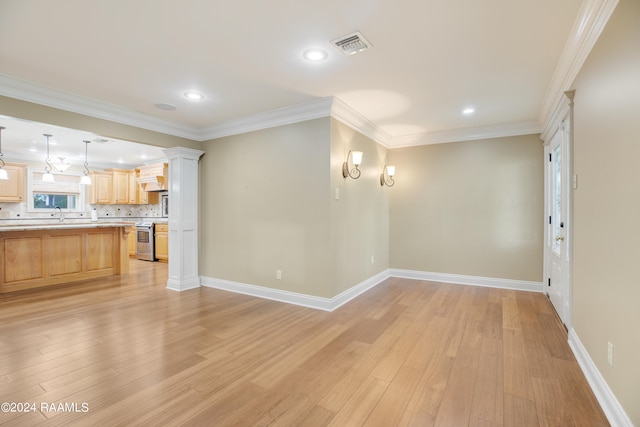 unfurnished living room with ornamental molding, light hardwood / wood-style flooring, and sink