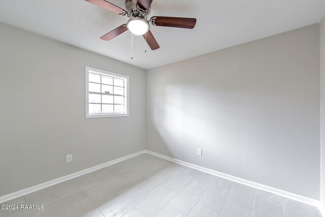 unfurnished room featuring ceiling fan