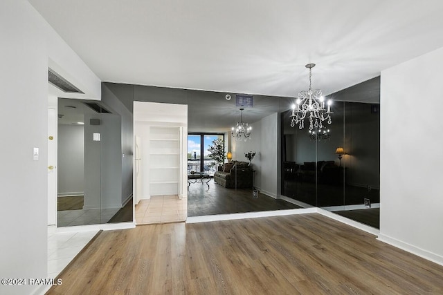 interior space featuring a notable chandelier and tile flooring