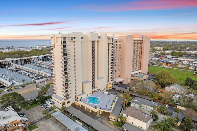 aerial view at dusk with a water view