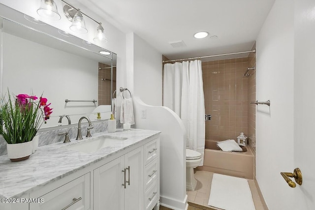 bathroom featuring visible vents, toilet, shower / bath combo, vanity, and tile patterned flooring