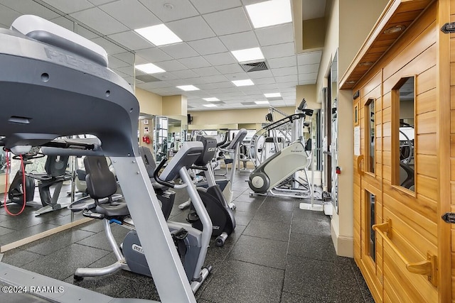 workout area featuring visible vents and a drop ceiling