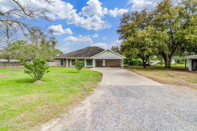 single story home with a carport and a front yard