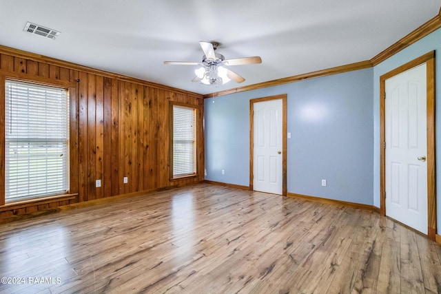 empty room with a healthy amount of sunlight and light wood-type flooring