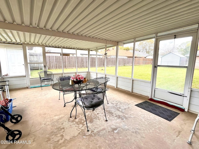 sunroom / solarium featuring a healthy amount of sunlight