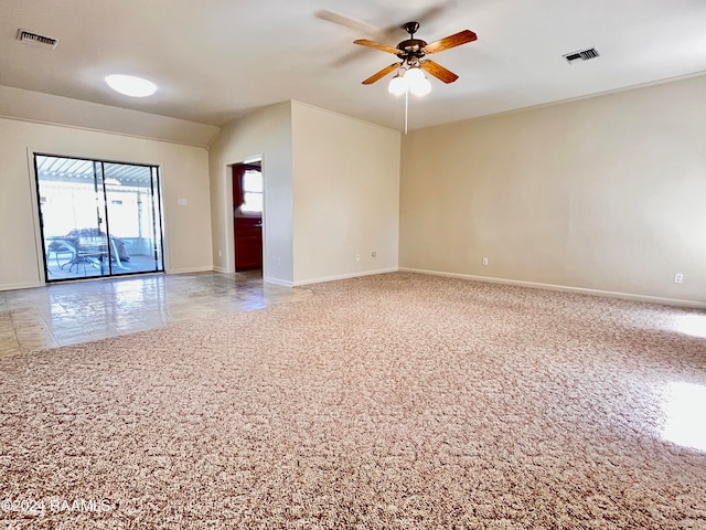 carpeted empty room featuring ceiling fan