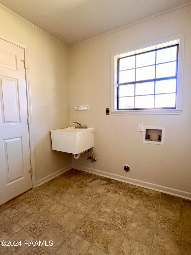 laundry area featuring hookup for a washing machine, ornamental molding, and sink