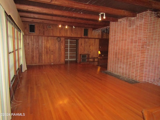 interior space featuring wooden walls and wood-type flooring