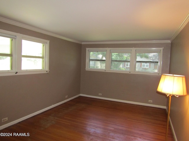 unfurnished room featuring dark hardwood / wood-style flooring and crown molding