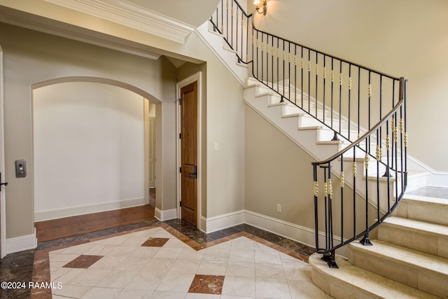 interior space with crown molding