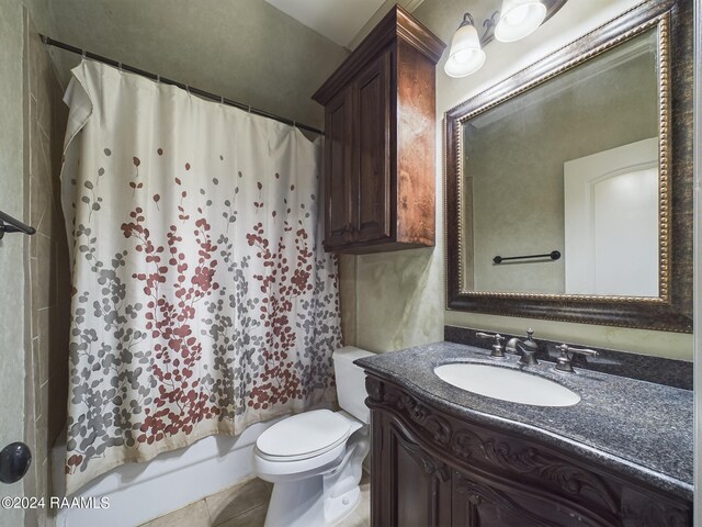 full bathroom with tile patterned flooring, vanity, toilet, and shower / bath combo with shower curtain