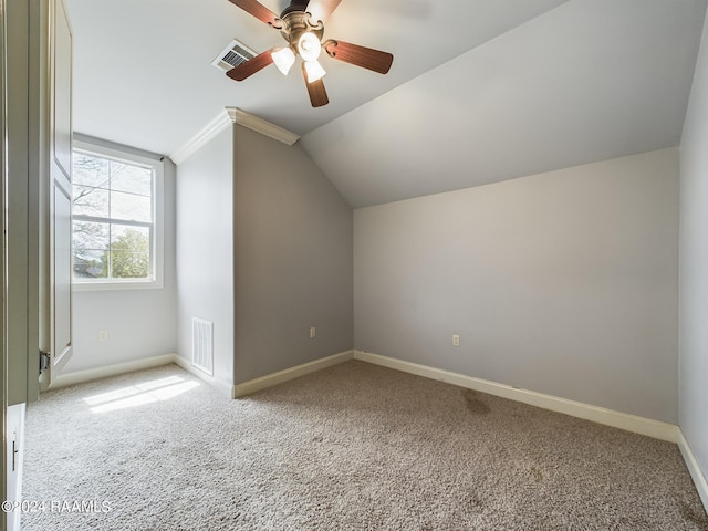 additional living space with lofted ceiling, light colored carpet, and ceiling fan