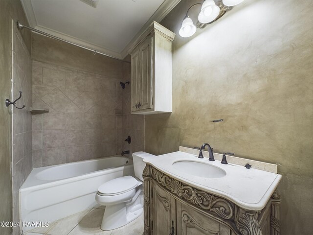 full bathroom with vanity, tiled shower / bath, tile patterned flooring, and toilet