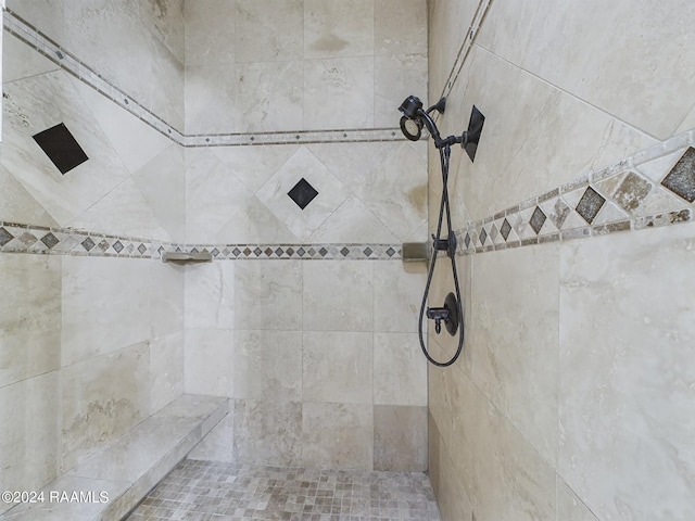 bathroom featuring tiled shower