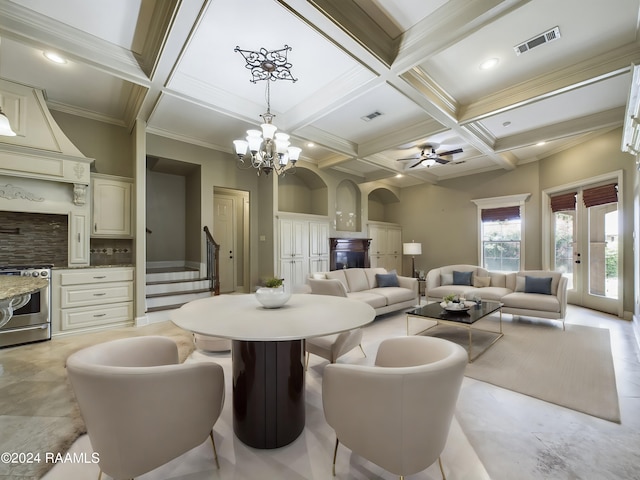 dining room with ornamental molding, coffered ceiling, ceiling fan with notable chandelier, and beam ceiling