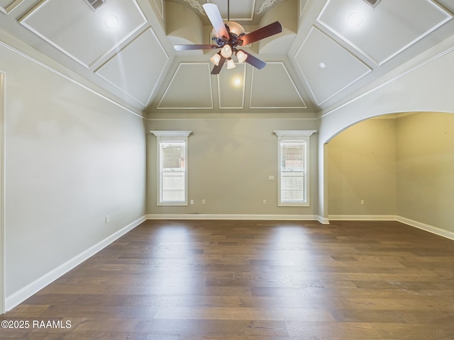 unfurnished room with plenty of natural light, dark wood-type flooring, lofted ceiling, and ceiling fan