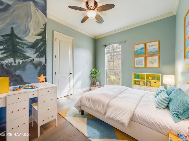 bedroom featuring ornamental molding, hardwood / wood-style floors, and ceiling fan