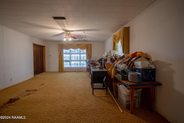 miscellaneous room featuring crown molding, ceiling fan, and carpet