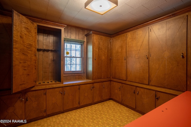 interior space featuring wood walls