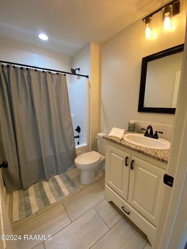 full bathroom featuring tile patterned flooring, toilet, vanity, and shower / bath combo