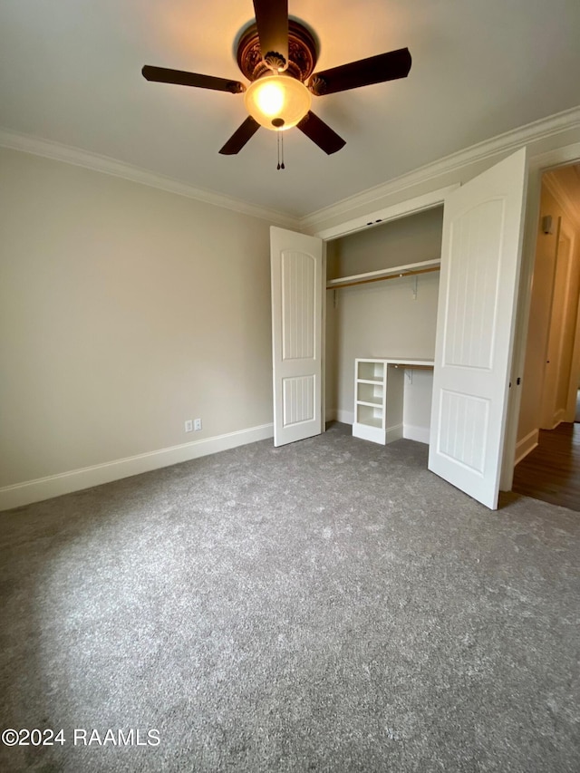 unfurnished bedroom with a closet, ceiling fan, ornamental molding, and carpet floors