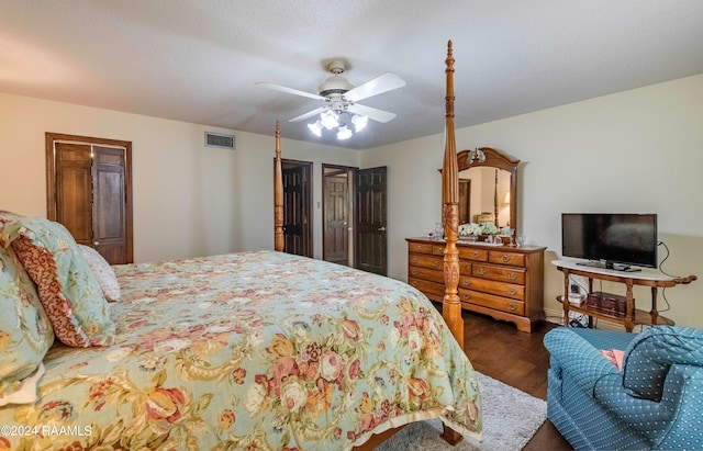 bedroom with ceiling fan and dark hardwood / wood-style floors