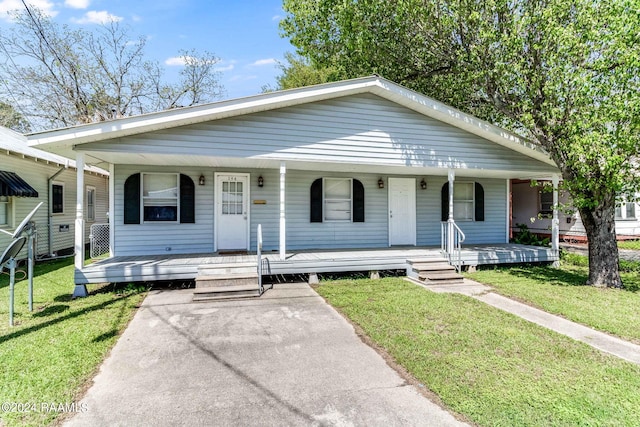 bungalow-style house featuring a porch and a front lawn