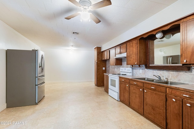 kitchen with white electric range, stainless steel fridge with ice dispenser, backsplash, ceiling fan, and sink