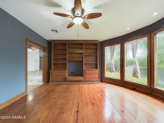 interior space featuring ceiling fan and hardwood / wood-style flooring