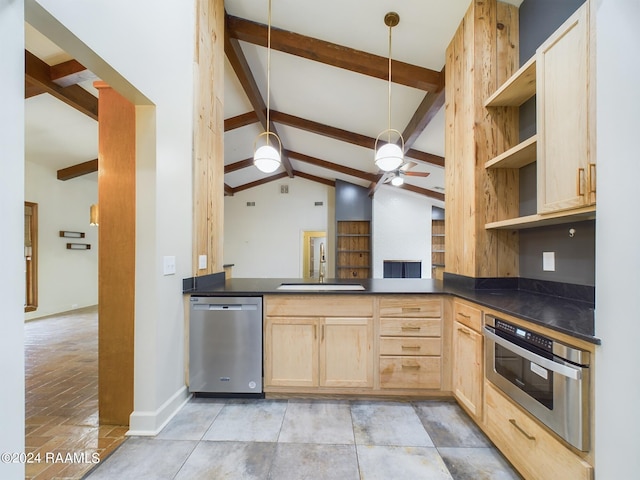 kitchen featuring decorative light fixtures, vaulted ceiling with beams, appliances with stainless steel finishes, sink, and ceiling fan